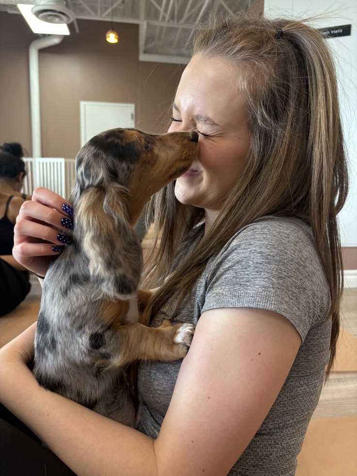 Cheryl holding dachshund puppy